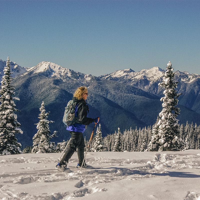 A woman snowshoes along Hurricane Ridge in Olympic National Park