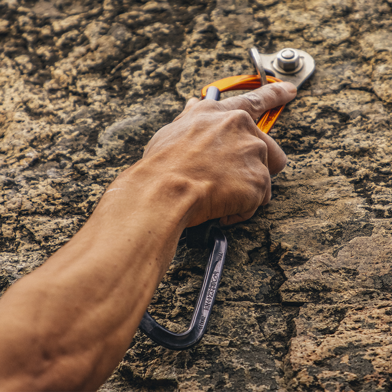 A man clips into an anchor