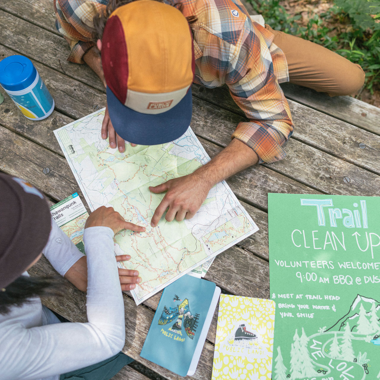 Two people looking at a map during a trail cleanup