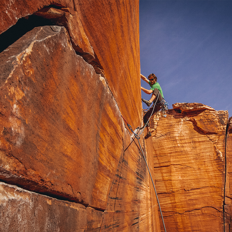 A man climbs Yin-Yang Crack in Red Rock Conservation Area, Las Vegas, NV